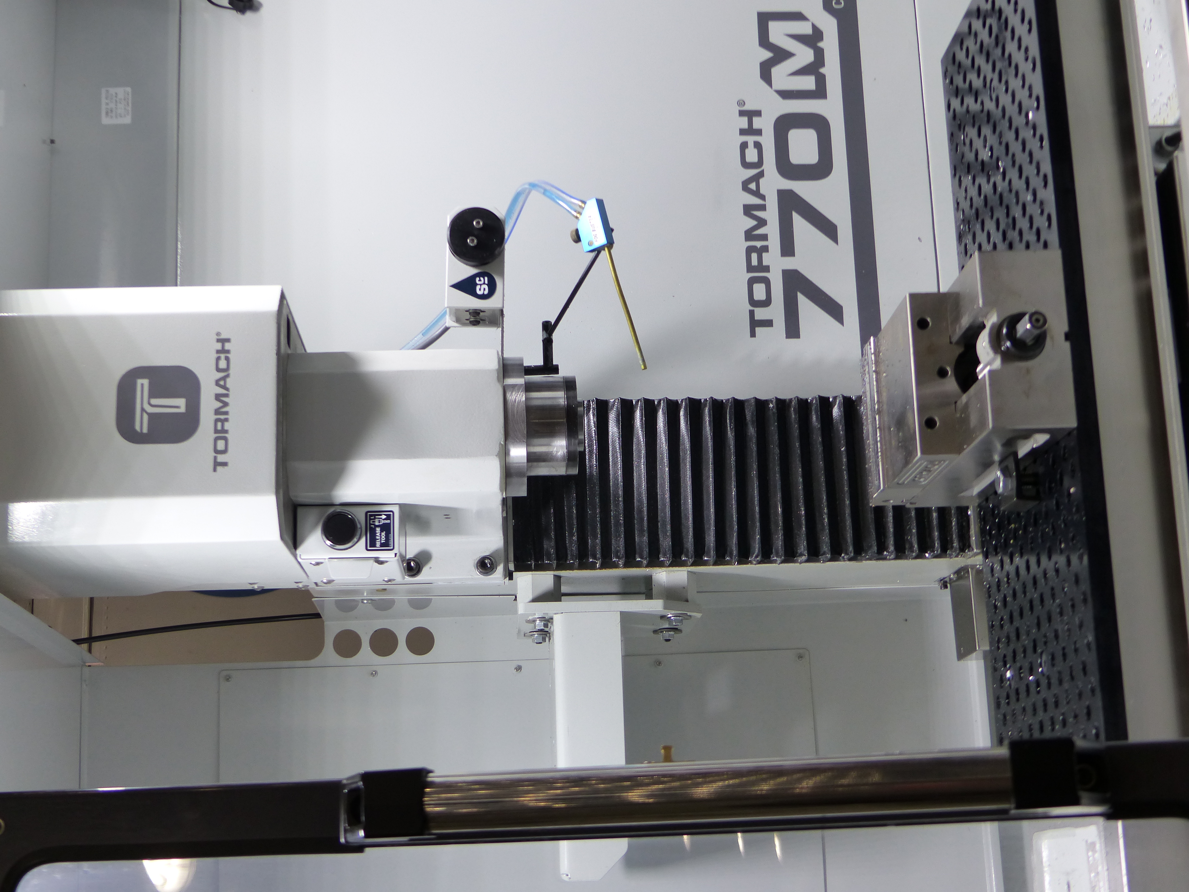 Clean CNC milling machine inside a real manufacturing environment